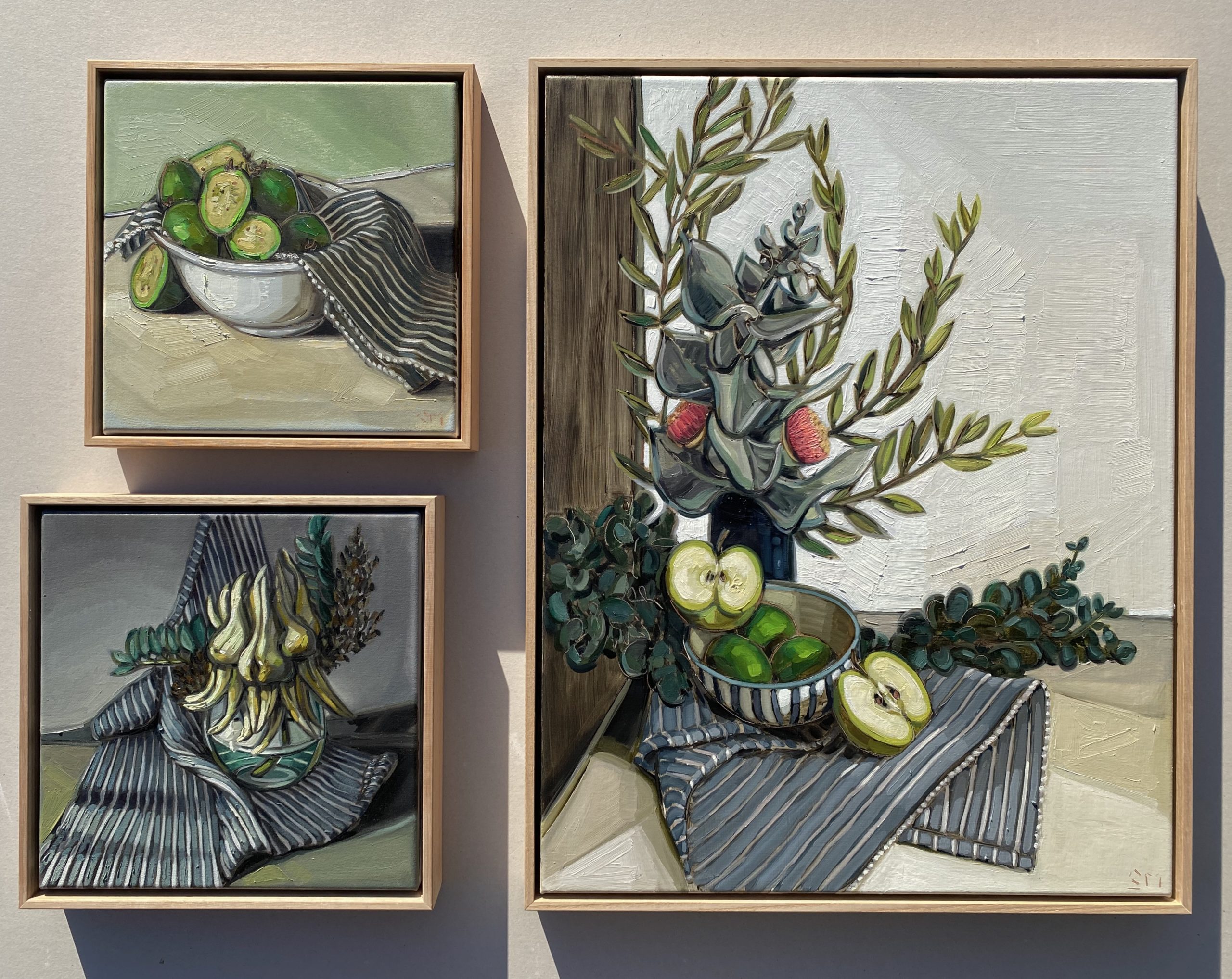 3 paintings of fruit and flowers.